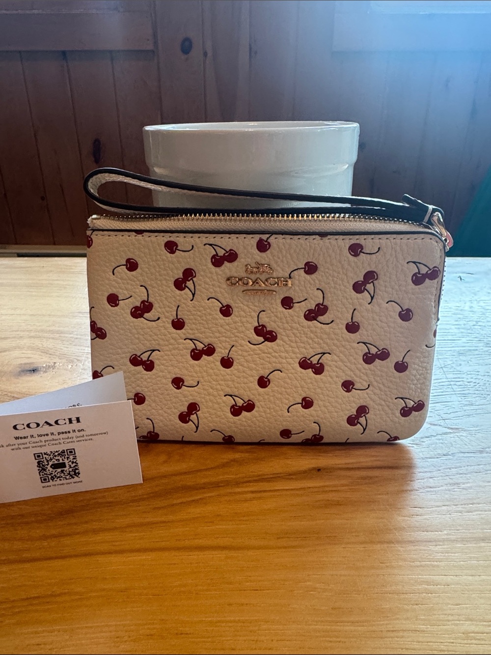 Coach Cream Pebble Leather Wristlet with Red Cherry Print